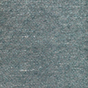 Close-up of textured fabric with looped pile and mottled effect.
