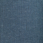 Close-up of blue twill fabric, resembling denim, with worn effect.