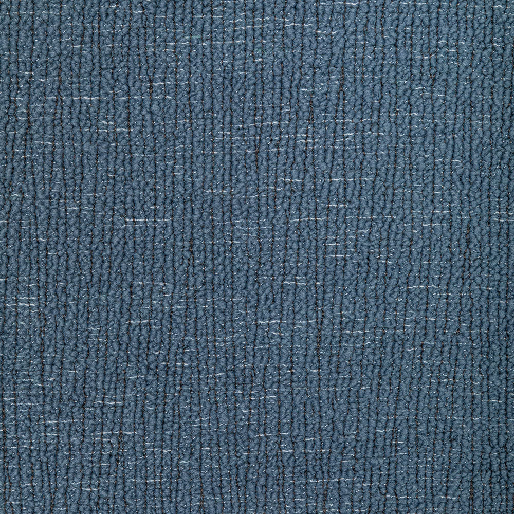 Close-up of blue twill fabric, resembling denim, with worn effect.