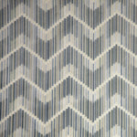 Patterned fabric with a chevron design in blue, gray, and cream.