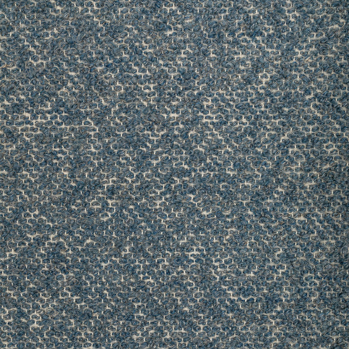 Close-up of looped pile textured material in shades of blue.
