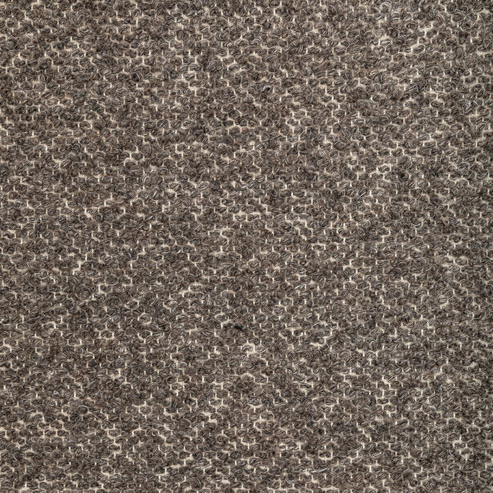 Close-up of loop pile carpet or fabric with speckled appearance.