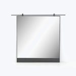 Retracted projection screen in protective casing on white wall mount.