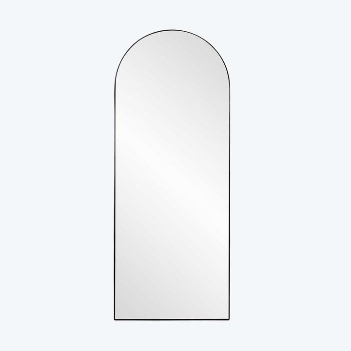 Modern minimalist arch-topped mirror reflecting light in sleek design.