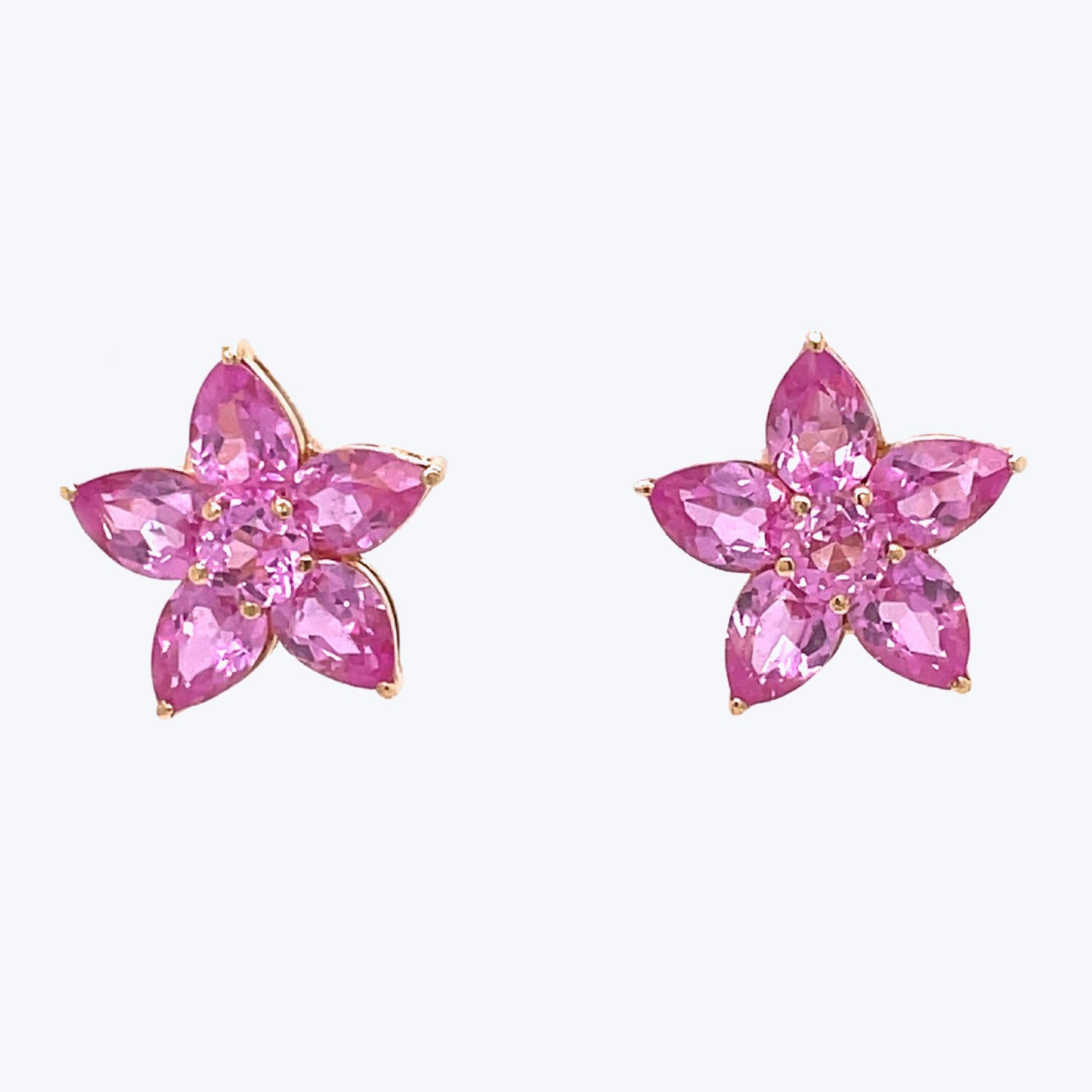 Elegant floral earrings crafted with faceted pink gemstones and gold.