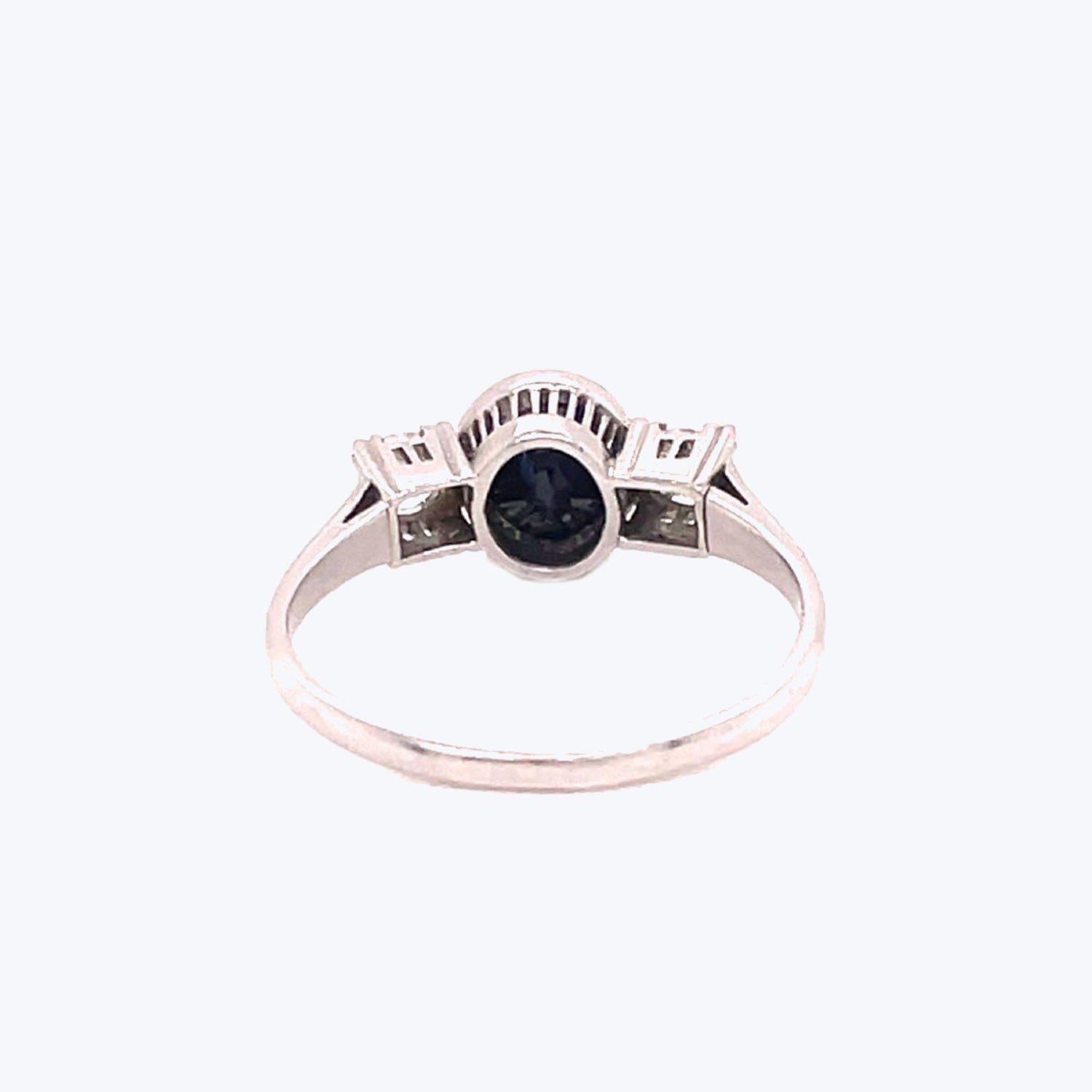 Elegant silver-toned ring with a black gemstone exuding sophistication.