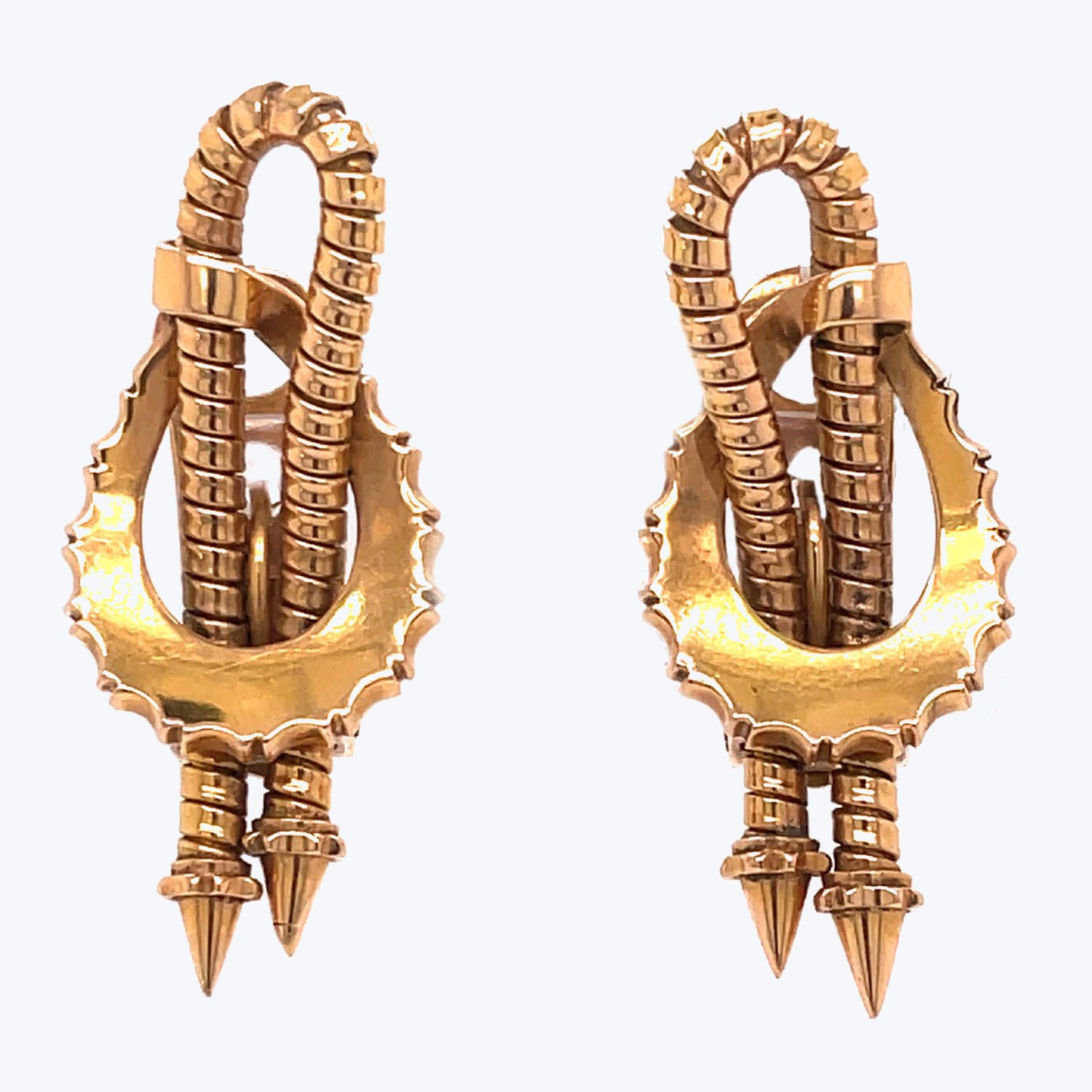 Golden African-inspired earrings with textured pattern and tribal design.