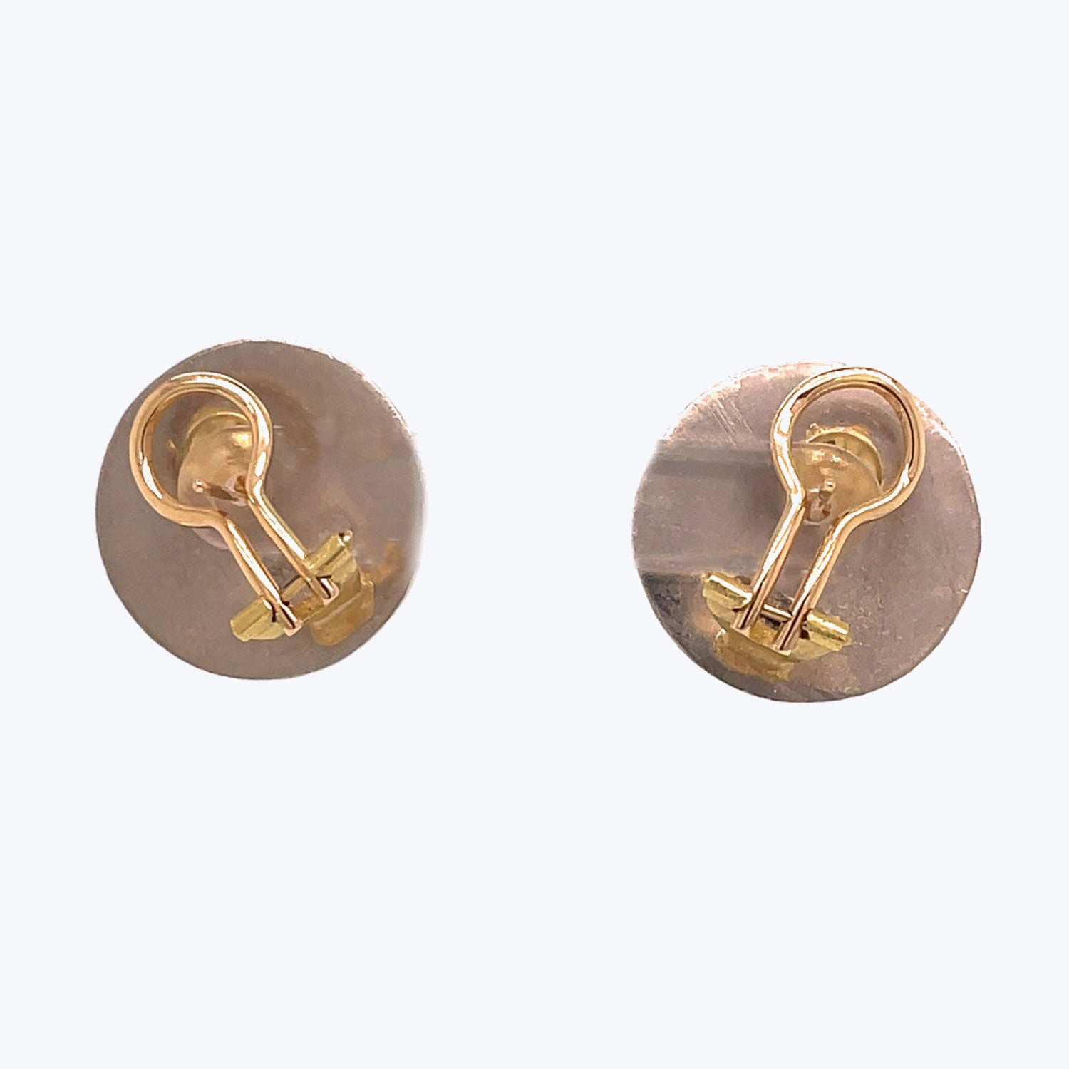 Two golden lapel pins featuring embossed light bulb designs.