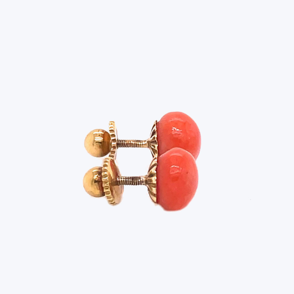 Pair of gold-toned cufflinks with red stone in screw-back design.