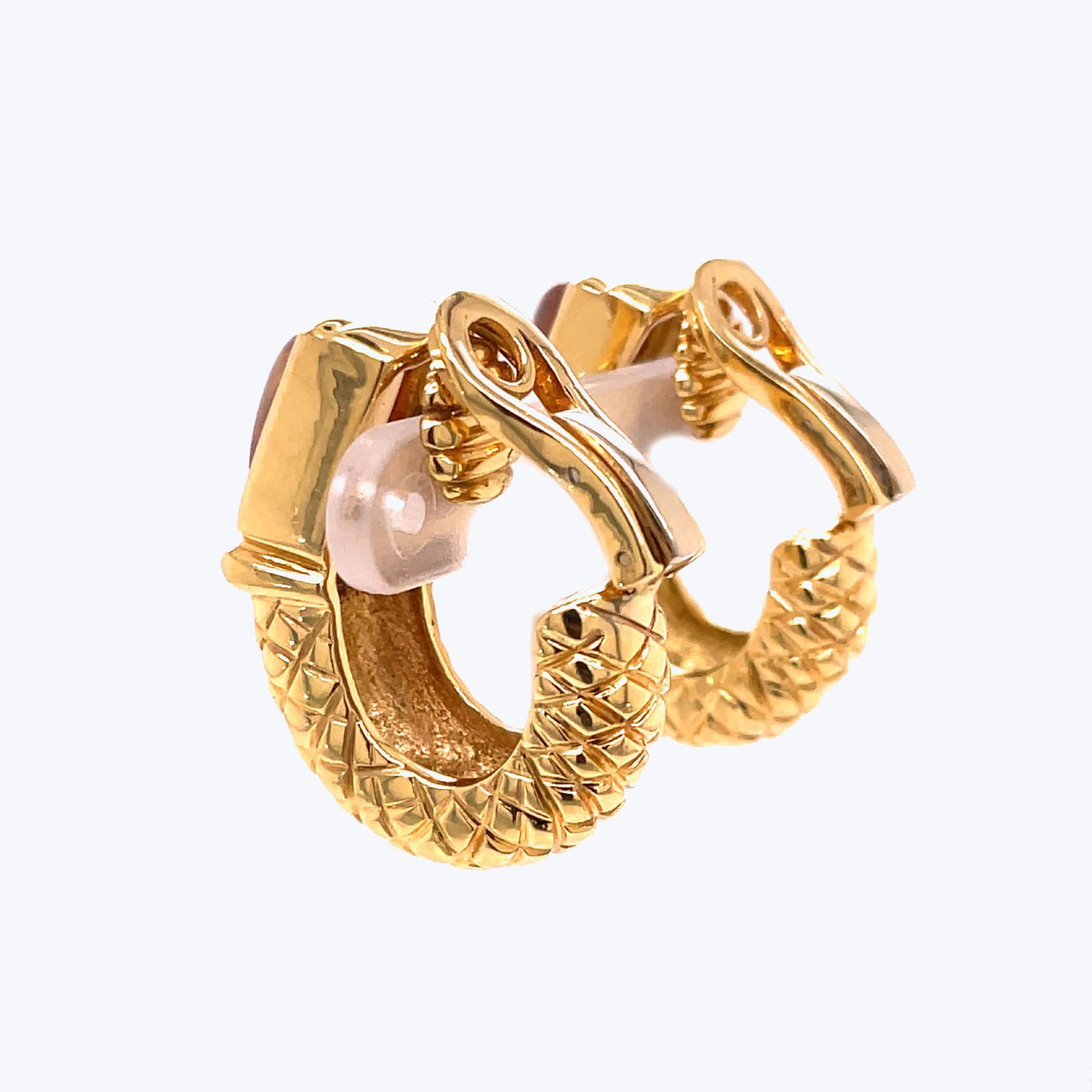 Stylish gold hoop earrings with textured surface and pearl detailing