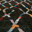 Vibrant patterned carpet with geometric diamond shapes on black background