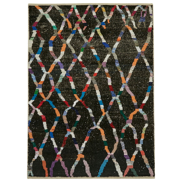 Vibrant and symmetrical rug with complex diamond pattern and colors.