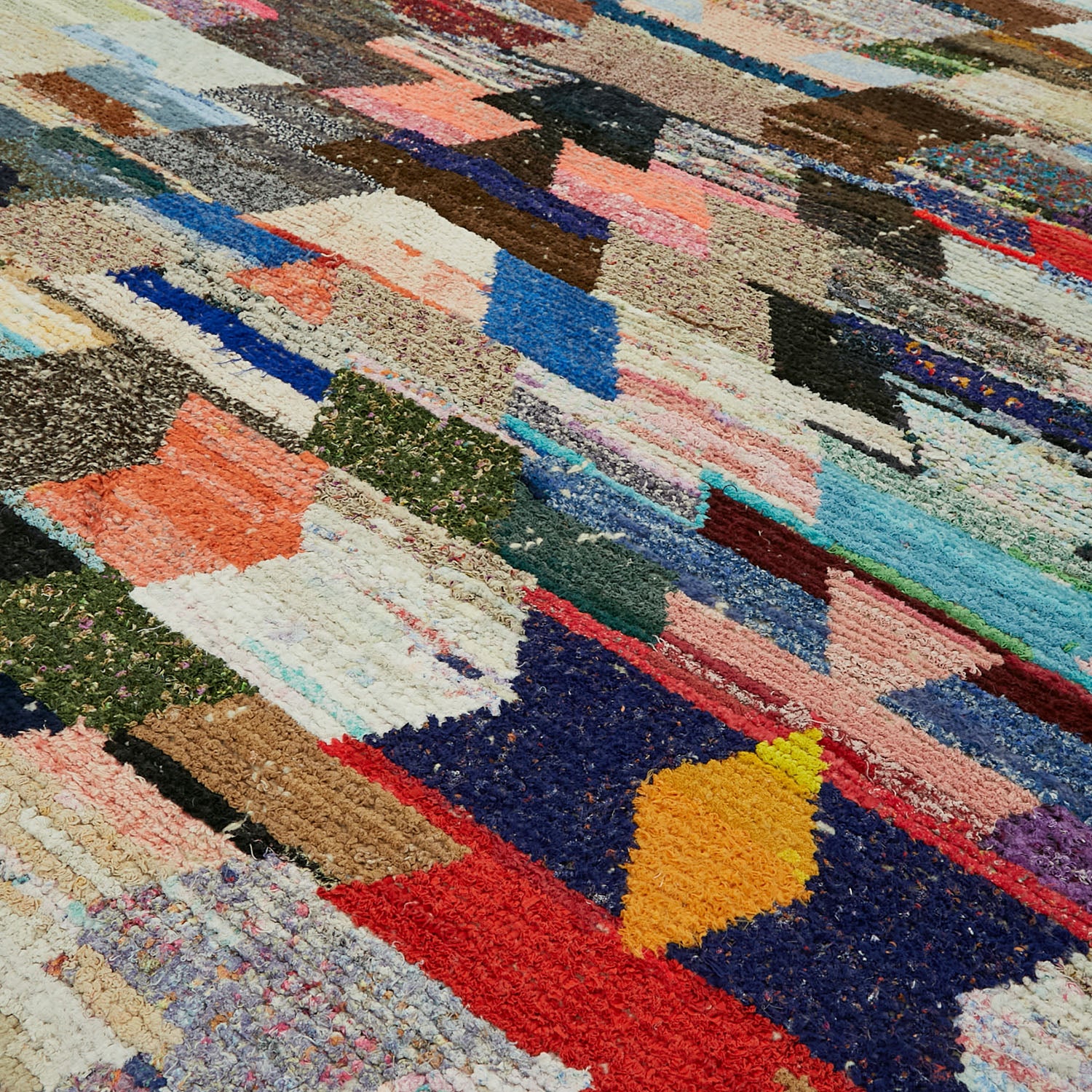 Vibrant, handwoven rug showcases colorful geometric patterns and intricate textures.