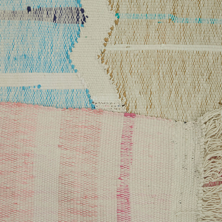 Vibrant, diverse hand-woven rugs showcase unique patterns and textures.