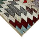 Vibrant, geometric-patterned area rug adds warmth and style to any space.