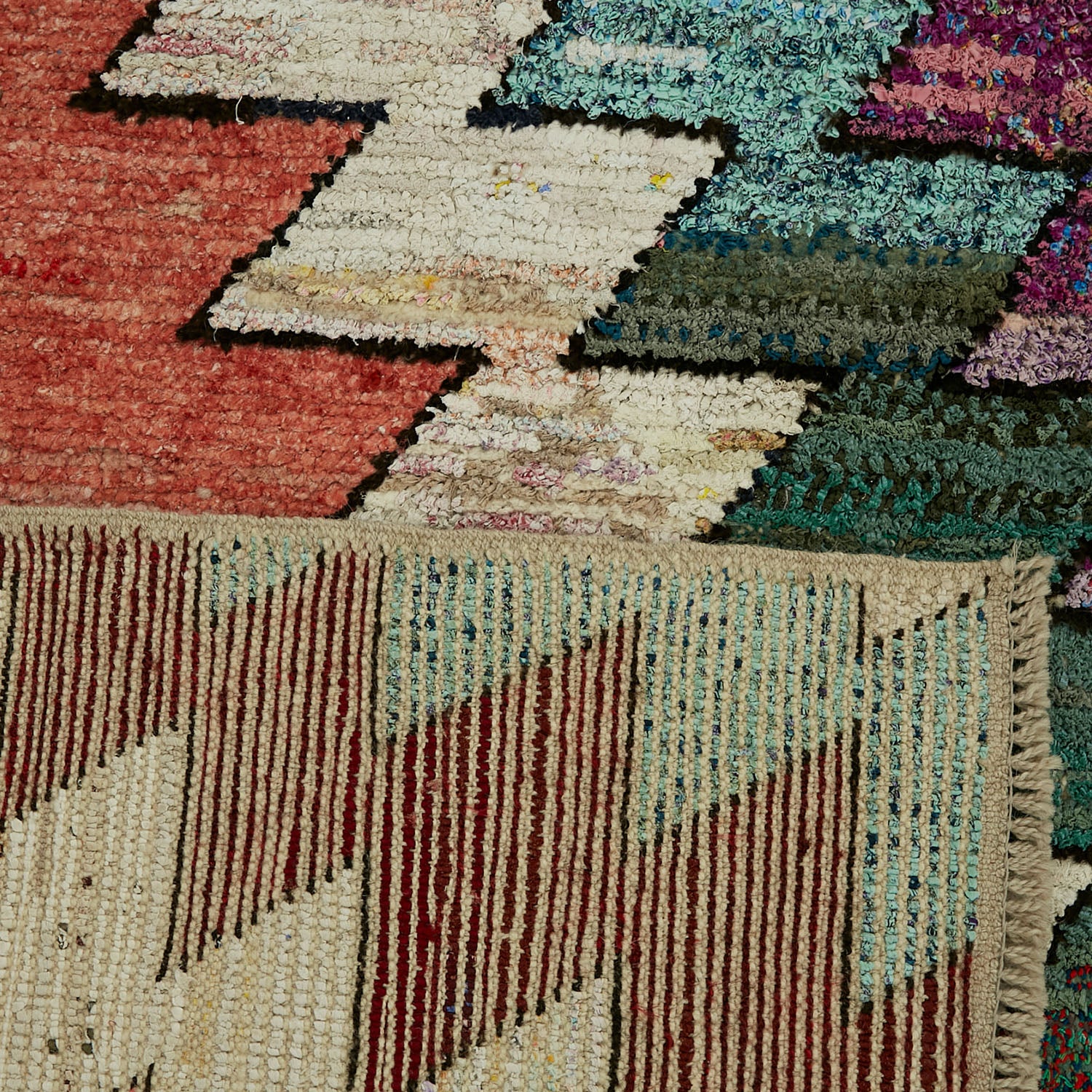 Close-up of a vibrant, textured textile showcasing intricate patterns.