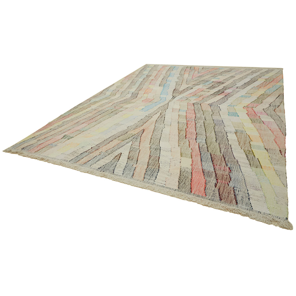 Colorful, abstract area rug with dynamic zigzag pattern on display.