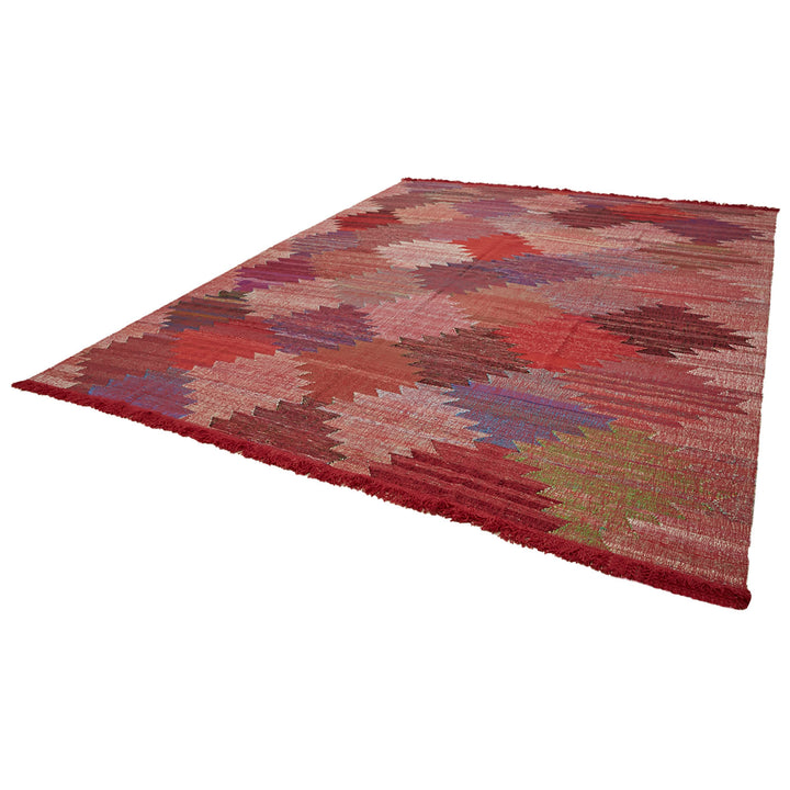 Vibrant and dynamic carpet design with an abstract striped pattern.