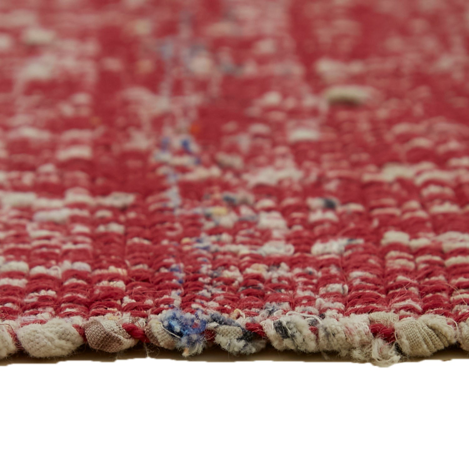 Close-up of a worn red and white woven fabric texture.