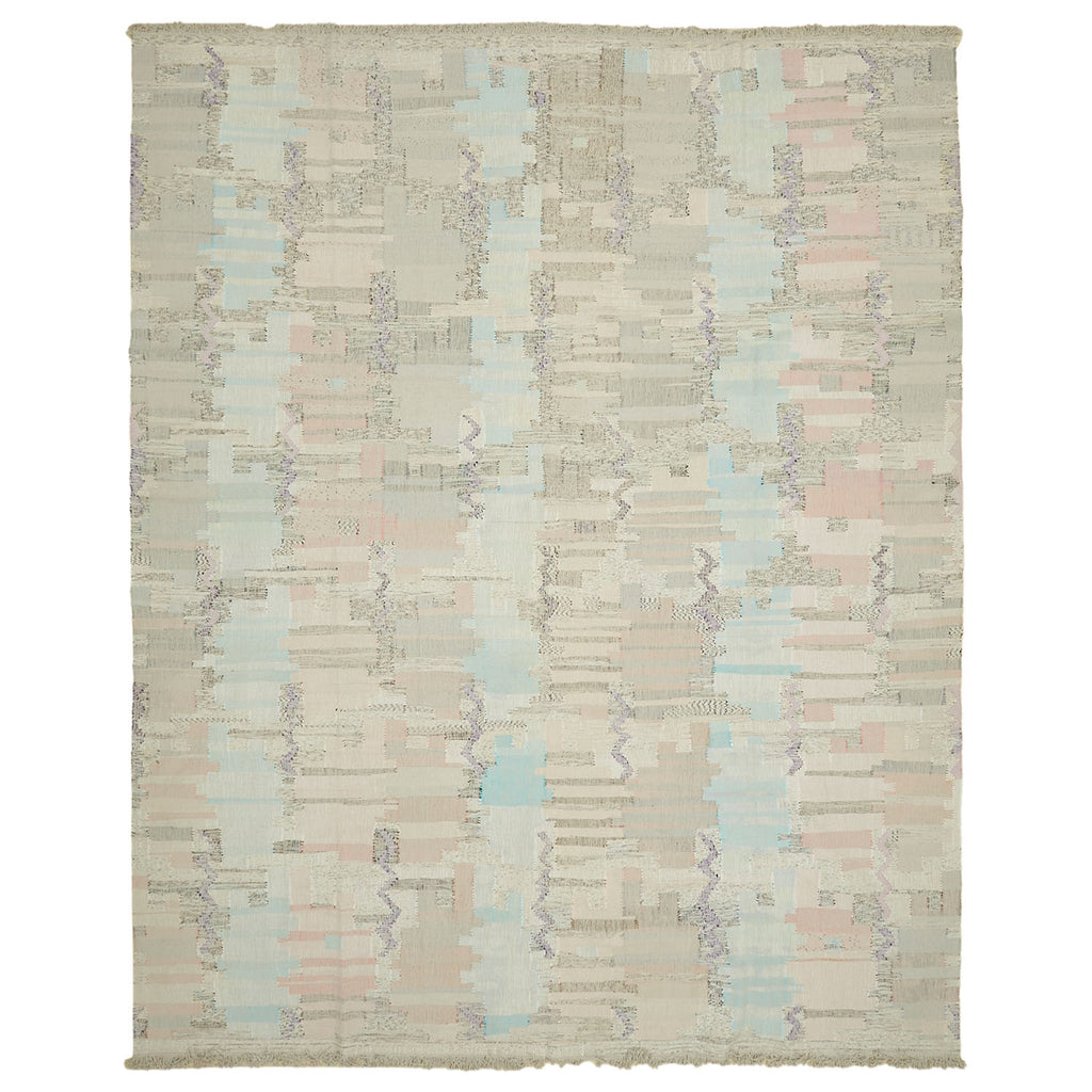 Abstract woven rug with glitch-like pattern adds modern aesthetic.