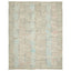 Abstract woven rug with glitch-like pattern adds modern aesthetic.