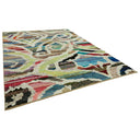 Contemporary-style area rug with abstract design in vibrant colors.