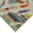 Vibrant and textured rug featuring a colorful abstract pattern.