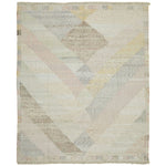 Contemporary handwoven textile featuring abstract geometric pattern in muted tones.
