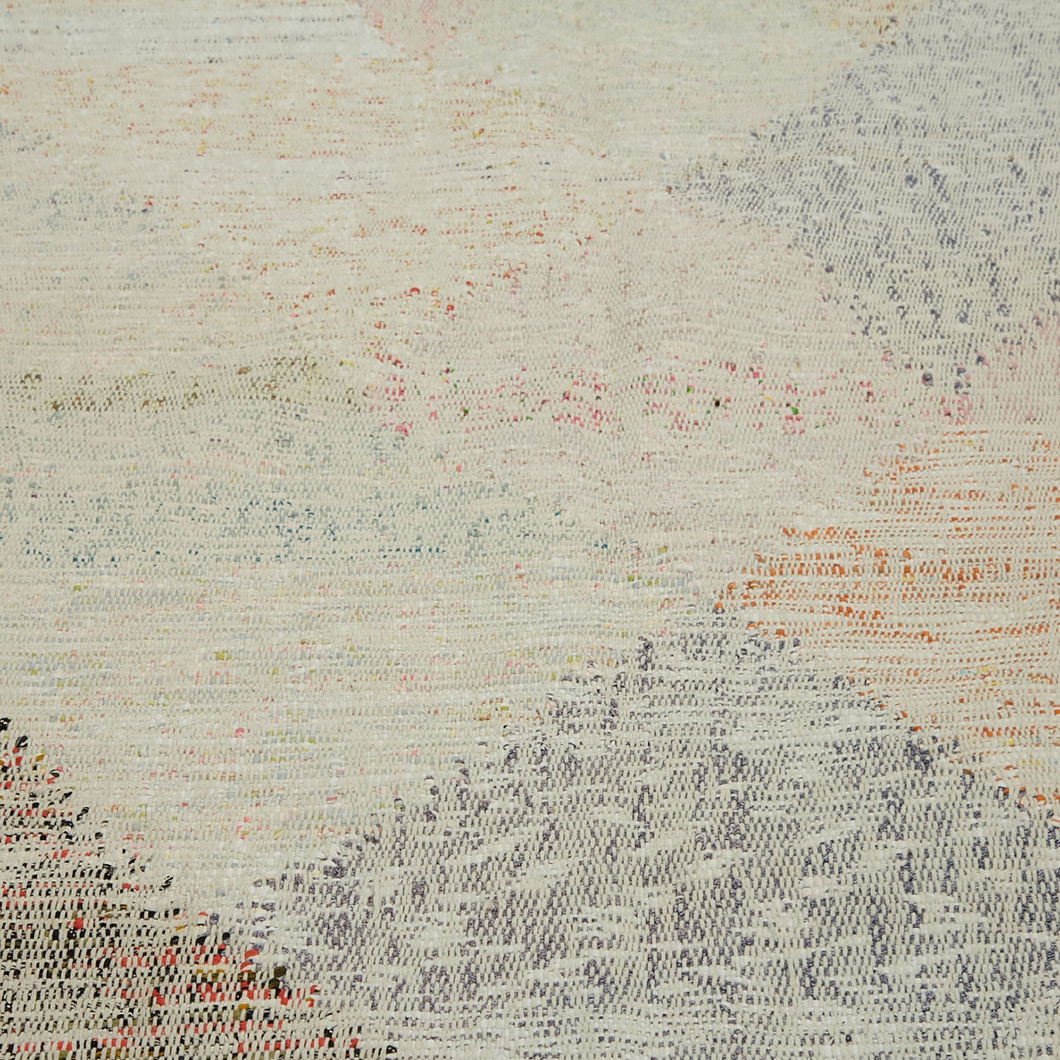 Close-up of intricate stitched fabric with subtle colors and flowing texture