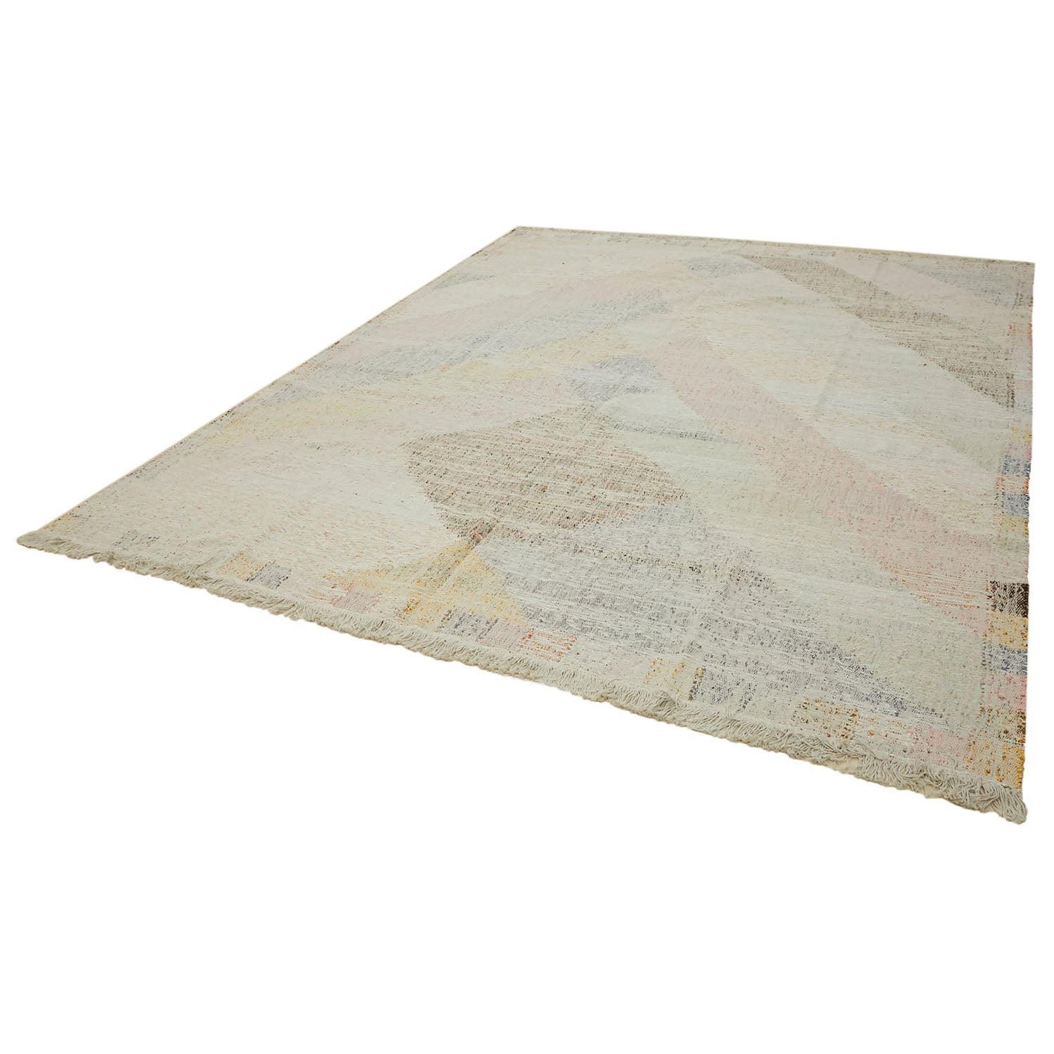 Flat-laid rug with subtle abstract design and soft muted colors.