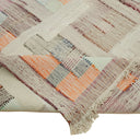 Colorful, geometric textile showcasing intricate patchwork and artisanal craftsmanship.