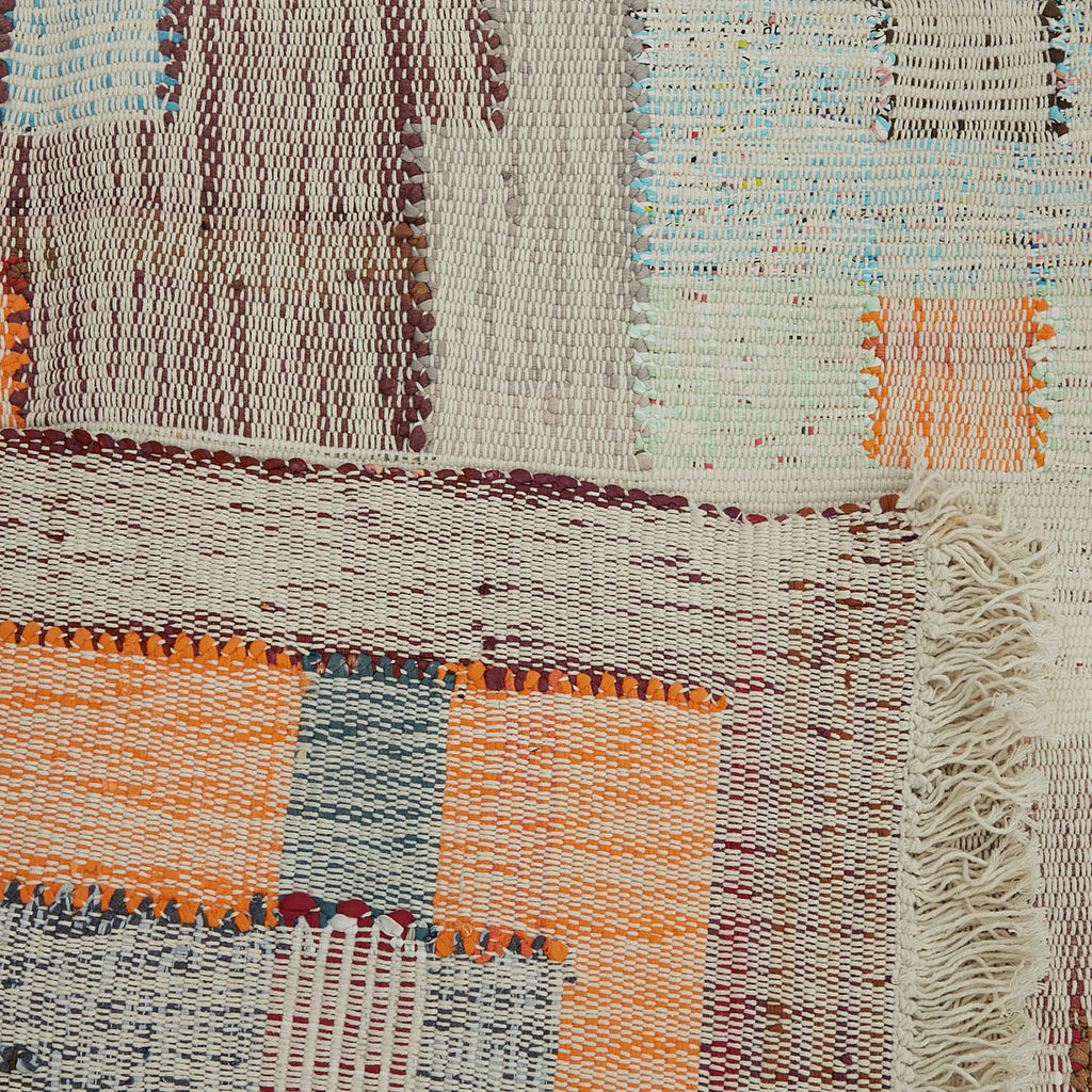 Vibrant handwoven textile showcases intricate patterns and diverse weaving techniques.