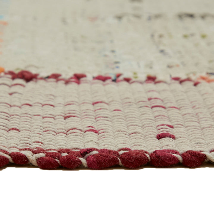 Close-up of a high-quality rug with ribbed texture and vibrant colors.