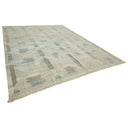 Contemporary rectangular area rug with assorted rectangles and squares.