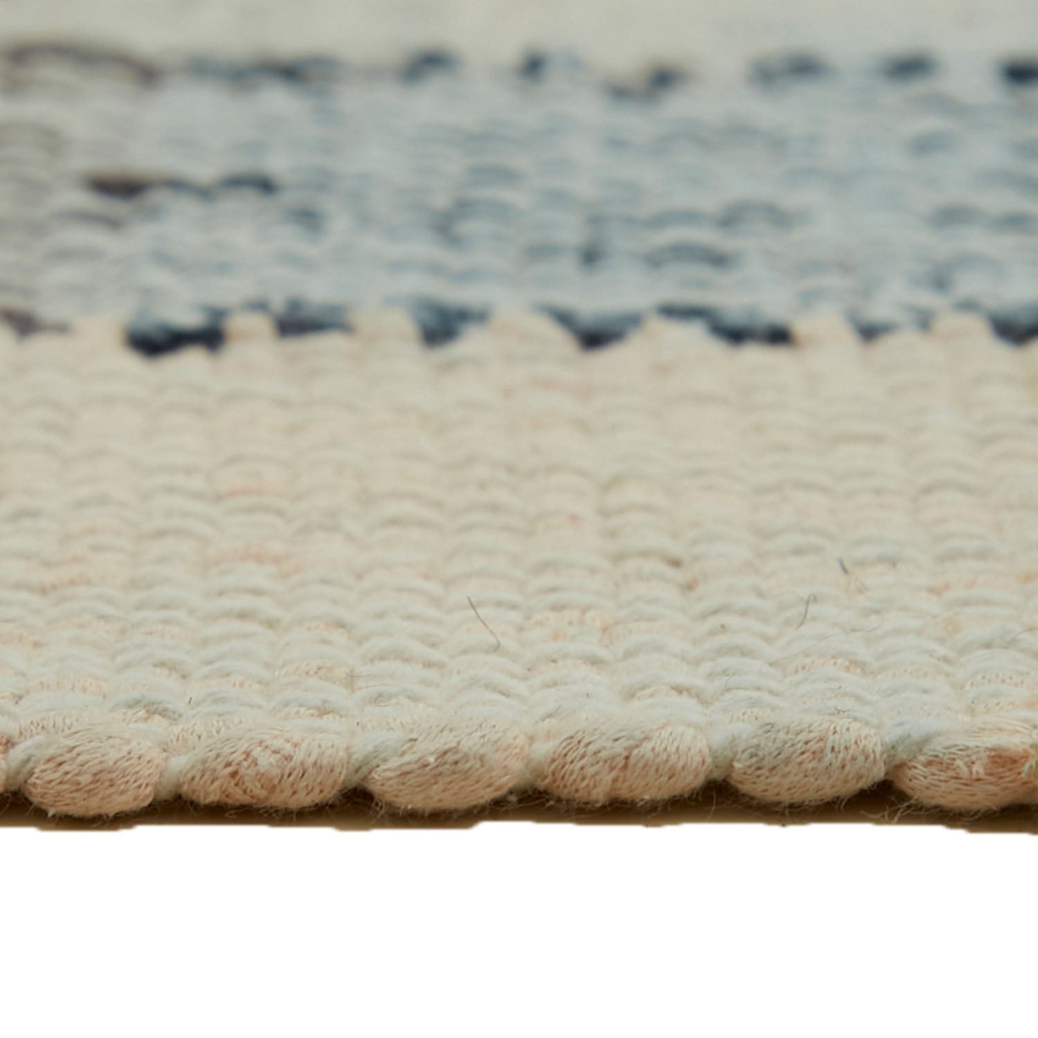 Detailed close-up of a high-quality, cream-colored carpet with textured surface.