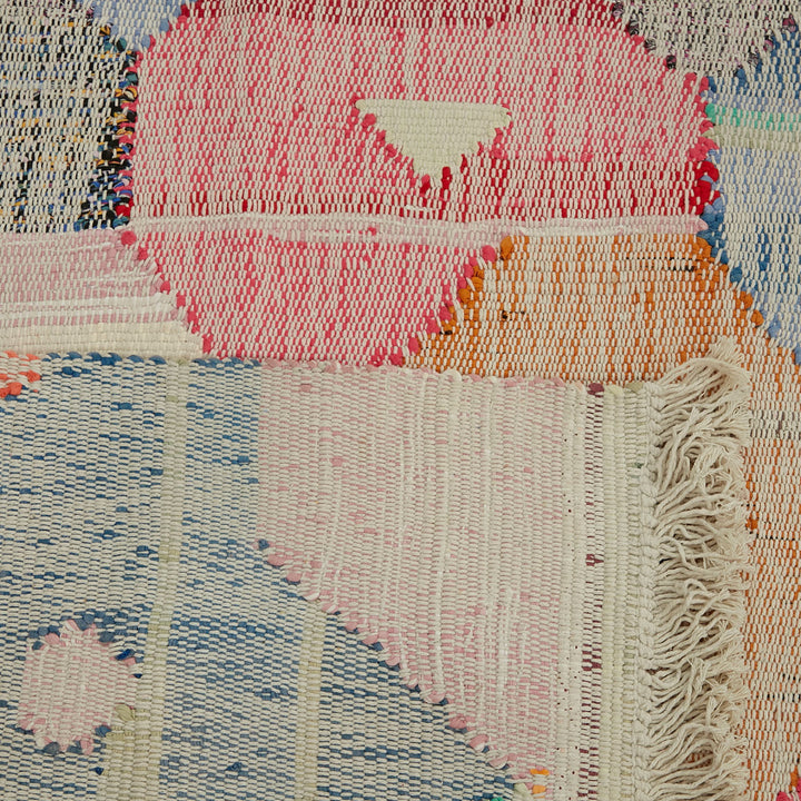 Vibrant, handcrafted fabric showcases intricate weaving techniques and color transition.