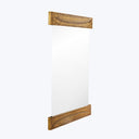 Modern handcrafted mirror with intricate wooden feather-like frame design.