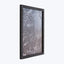 Contemporary black frame showcases intricate monochromatic frosted glass artwork.