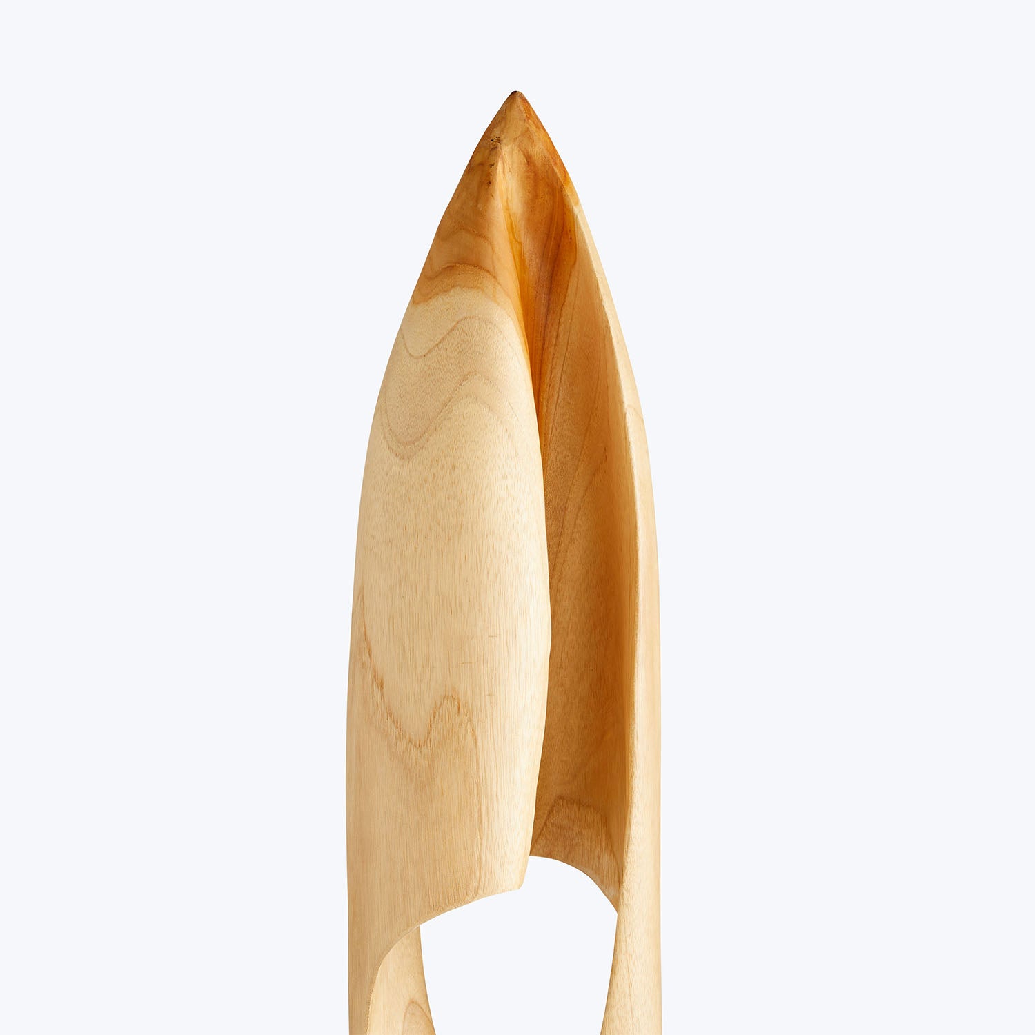Light-colored wooden salad tong with smooth texture and natural grain