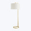 Contemporary floor lamp with minimalist design, brass finish and cylindrical lampshade
