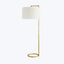 Minimalist and sleek, a modern floor lamp with gold accents.