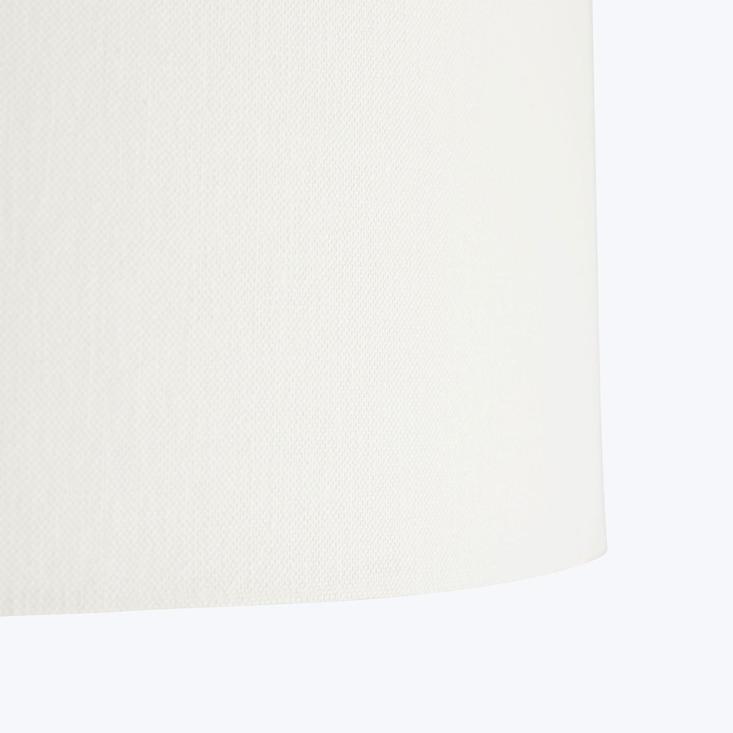Off-white textured material with a subtle fold. Soft lighting.