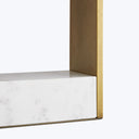 Minimalist and elegant furniture piece with marble and brass accents.
