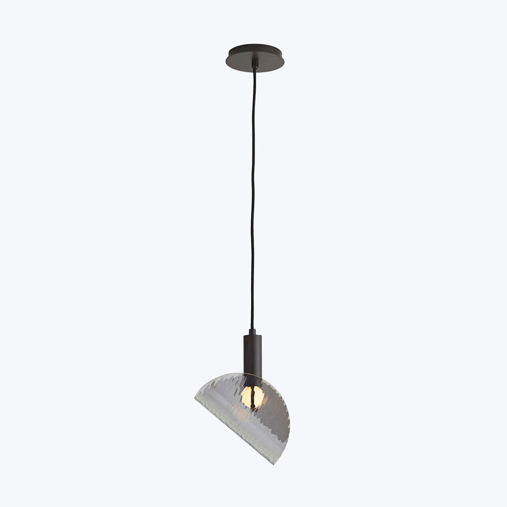 Modern pendant light fixture with ribbed lampshade hanging from ceiling.