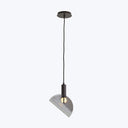 Modern pendant light fixture with ribbed lampshade hanging from ceiling.