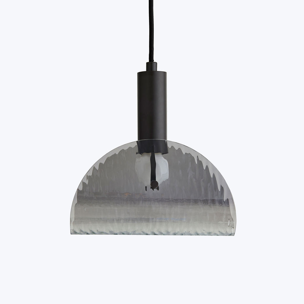 Modern pendant light fixture with ribbed translucent shade and minimalist design.