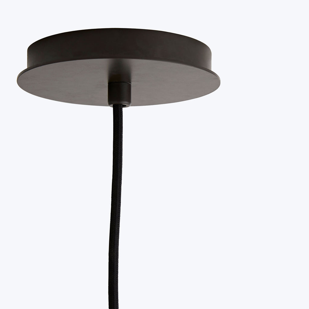 Minimalistic pendant light showcases sleek black canopy against neutral background.