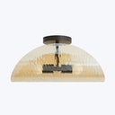 Semi-flush mount ceiling light fixture with textured glass shade.