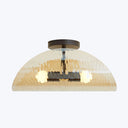 Contemporary ceiling light fixture with textured glass lampshade and warm illumination.