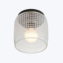 Modern ceiling light fixture with grid design emits warm glow.